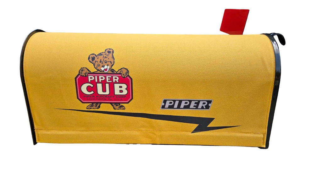 Aero Mail Covers yellow sailcloth canvas mailbox cover featuring a Piper Cub bear logo and vintage aircraft branding.